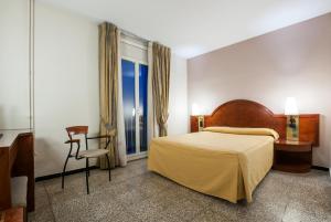 Postel nebo postele na pokoji v ubytování Hotel Gaudi