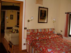 A bed or beds in a room at Agriturismo Corte Bebbi