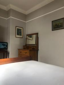 Postel nebo postele na pokoji v ubytování Harveys Guest House