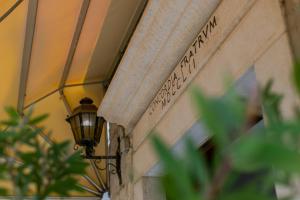 a street light on the side of a building at Hotel Concordia in Trogir