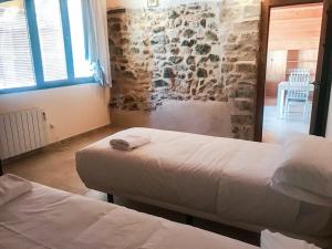 Postel nebo postele na pokoji v ubytování Apartamentos Casa Les Valeres