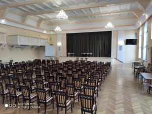 a large room with chairs and a podium in the middle at Hotel i Restauracja Admirał in Legnica