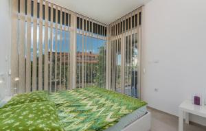 Posteľ alebo postele v izbe v ubytovaní Apartment Vedran with Pool