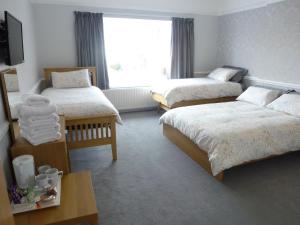 Postel nebo postele na pokoji v ubytování Orrell Park Hotel
