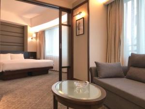 Postel nebo postele na pokoji v ubytování South Pacific Hotel