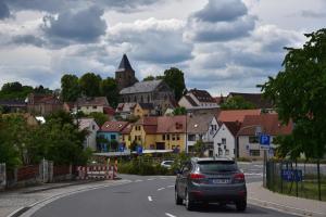 a car driving down a road in a town at Ferienwohnung Abspanne in Bad Bibra +18 photos