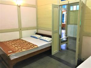 Rúm í herbergi á Hotel Wismancala Kaliurang