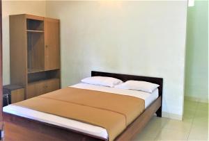 Rúm í herbergi á Hotel Wismancala Kaliurang