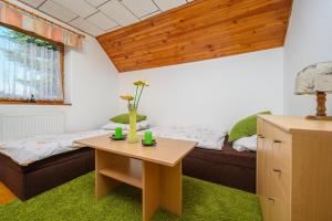 Posteľ alebo postele v izbe v ubytovaní Chalupa pod Ještědem