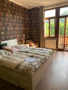 a bedroom with a bed with a book on it at Hotelzimmer im alten Reihenhaus auf der Stadtmauer in Bacharach