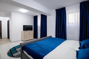 Postel nebo postele na pokoji v ubytování Simona Apartaments