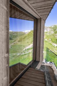 a glass house with a view at Bergman Mountain Hotel in Breuil-Cervinia