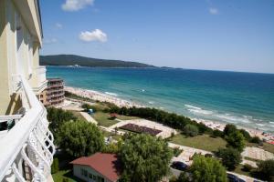 a view of the beach from a balcony of a building at Hotel Perla Beach Club - All Inclusive in Primorsko