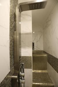 a shower with a glass door in a bathroom at Vico Gelso Napoli in Naples