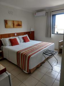 Ένα ή περισσότερα κρεβάτια σε δωμάτιο στο Hotel Riviera Lins