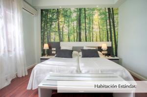 Postel nebo postele na pokoji v ubytování Hotel Montermoso