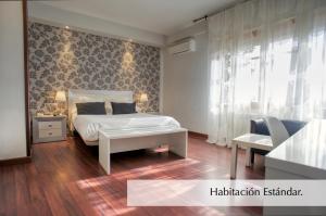 Postel nebo postele na pokoji v ubytování Hotel Montermoso