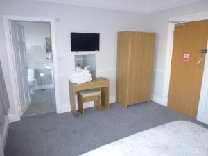 TV a/nebo společenská místnost v ubytování Orrell Park Hotel