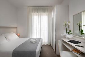 Postel nebo postele na pokoji v ubytování Hotel Cristina Corona