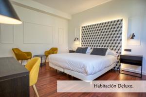 Postel nebo postele na pokoji v ubytování Hotel Montermoso