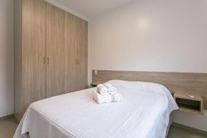 Ein Bett oder Betten in einem Zimmer der Unterkunft Modernos apartamentos para 4 ou 5 pessoas