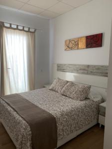 Posteľ alebo postele v izbe v ubytovaní Apartamentos Costa de la Luz Béjar 28-30