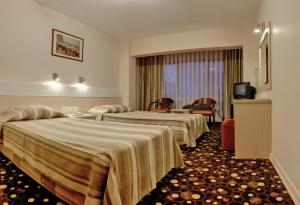 Кровать или кровати в номере Yumukoglu Hotel