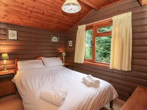 Postel nebo postele na pokoji v ubytování Millmore Cabin