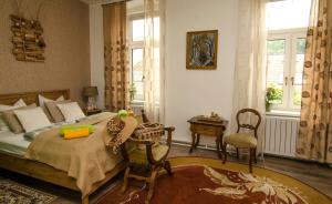 Postel nebo postele na pokoji v ubytování Trubarjev Art Boutique hotel
