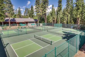 a group of tennis courts with trees in the background at Delightful Northstar Condo in Kingswood Estates