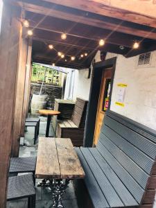 a table and benches on the outside of a restaurant at The Drymen Inn in Drymen