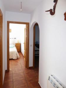 a room with a bedroom and a bed and a floor at Vivienda rural casa manoli 