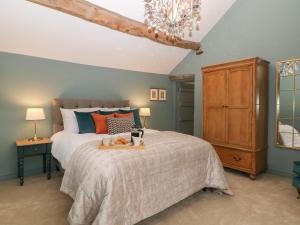 Ένα ή περισσότερα κρεβάτια σε δωμάτιο στο Overlea Cottage