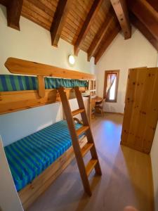 A bed or beds in a room at Residence Tarvisio Camporosso