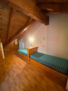 A bed or beds in a room at Residence Tarvisio Camporosso