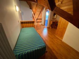 A bed or beds in a room at Residence Tarvisio Camporosso