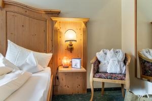 Postel nebo postele na pokoji v ubytování Hotel Gletscherblick
