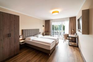 Postel nebo postele na pokoji v ubytování Hotel Spree-idyll