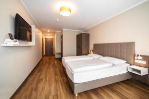 Postel nebo postele na pokoji v ubytování Hotel Spree-idyll