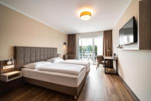 Postel nebo postele na pokoji v ubytování Hotel Spree-idyll