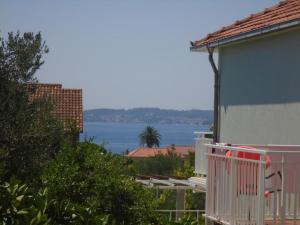 a view of the ocean from a house at Apartments Vidic in Orebić