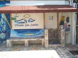 Um certificado, prêmio, placa ou outro documento exibido em Posada San Nicolas