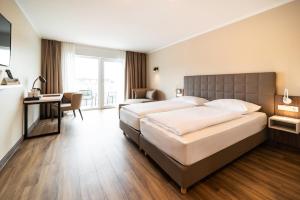 Postel nebo postele na pokoji v ubytování Hotel Spree-idyll