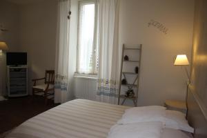 Postel nebo postele na pokoji v ubytování Chambre d'Hôtes de L'Abricotier