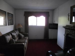 a living room with a couch and a window at Oak Square 309 in Gatlinburg +6 photos