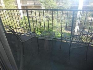 two chairs on a balcony with a fence at Oak Square 309 in Gatlinburg