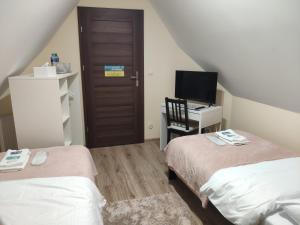 Postel nebo postele na pokoji v ubytování Pod Skrzydłami Podlasia