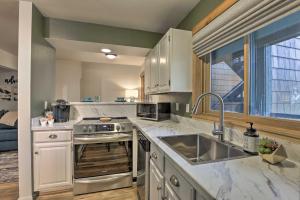 a kitchen with a sink and a stove top oven at Steamboat Springs Studio Less Than 1 Mi to Ski Resort in Steamboat Springs