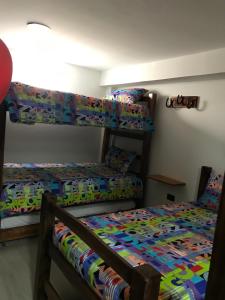 Postel nebo postele na pokoji v ubytování Hotel Palmi
