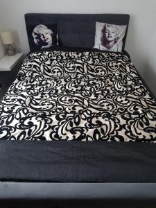Кровать или кровати в номере Apartament 3D